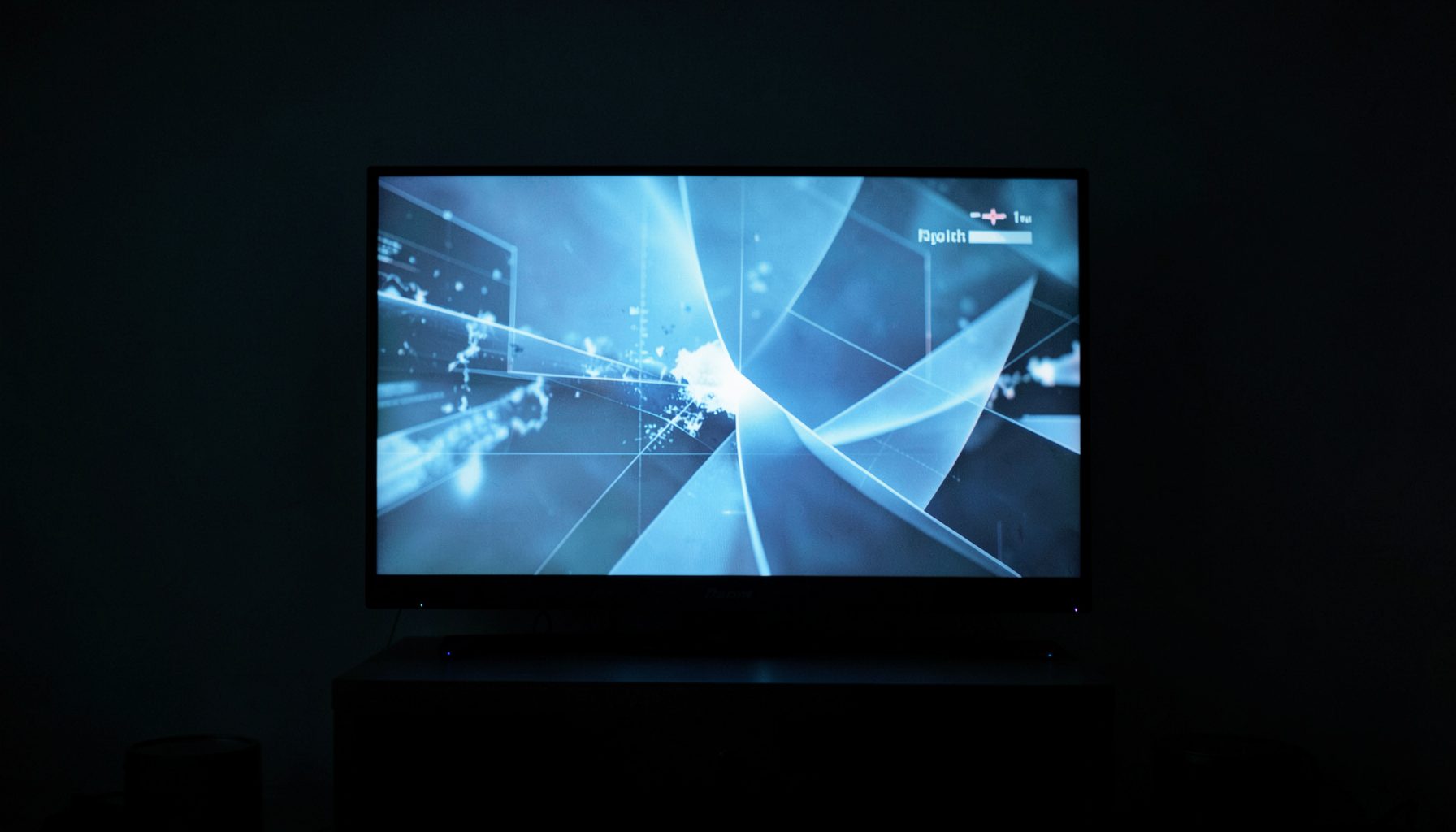 A television screen glowing in a dim room, cool blue and grey tones, abstract broadcast imagery suggesting a news report.